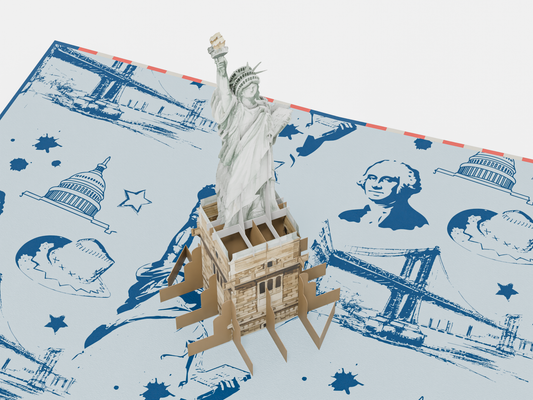 A 3D pop-up greeting card featuring the Statue of Liberty. The card’s cover is decorated with bold red, white, and blue stripes, the silhouette of the Statue of Liberty, and text reading "4th July Independence Day." The inside reveals an intricate 3D model of the Statue of Liberty standing on its pedestal, set against a background with blue sketches of iconic American landmarks. Perfect for celebrating U.S. Independence Day.